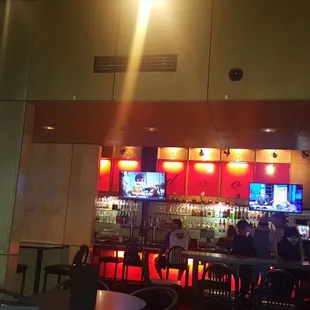 a view of a bar with neon lights