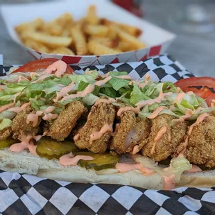 Shrimp poboy and crinkle cut fries