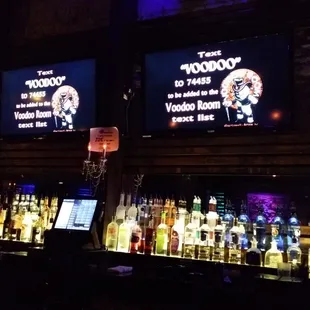 a bar with a lot of liquor bottles