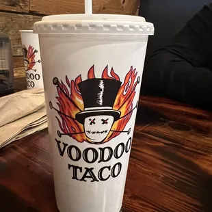 a plastic cup with a straw