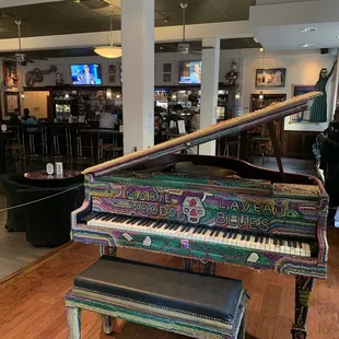 a grand piano in a restaurant