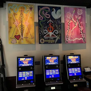a row of slot machines in a casino
