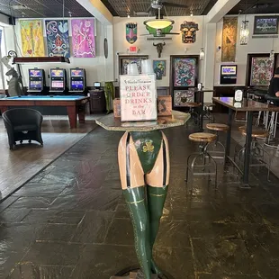 a woman in a green bikini and green boots
