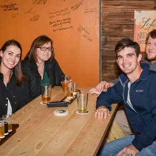 a group of people sitting at a table