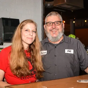 a man and a woman at a bar