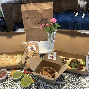 Burrito, tacos, chips, salsa, guac, dulce de leche bread pudding