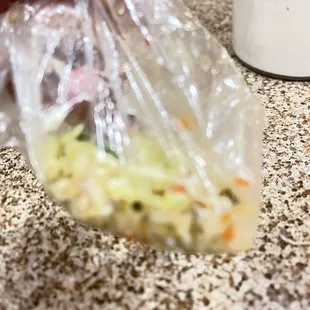 a person holding a bag of food