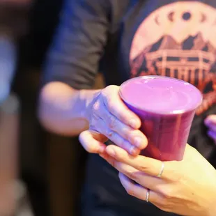 a woman holding a cup of coffee