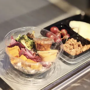 a variety of food in plastic containers