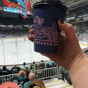 a person holding a cup of coffee