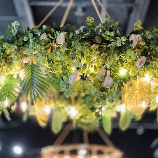a floral chandelier hanging from the ceiling