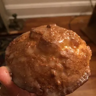 Corn muffin covered in honey butter.