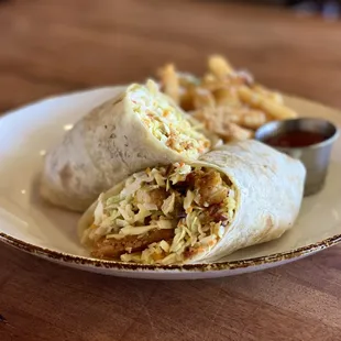 a burrito and fries on a plate