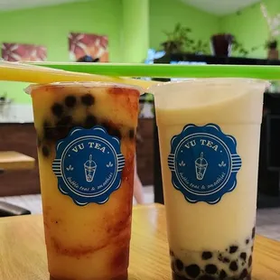 Mangonada with tapioca boba and a coconut mango smoothie with tapioca boba!