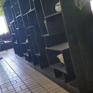 A book shelf that covers the other part of the Vu Tea