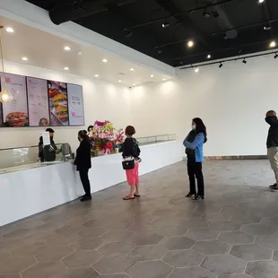 a group of people standing in front of a counter