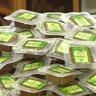 a pile of packaged sandwiches