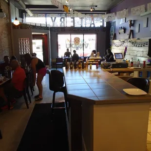 Looking towards the front door from the back hallway.