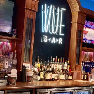 a bar with a neon sign