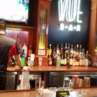 a man standing at the bar