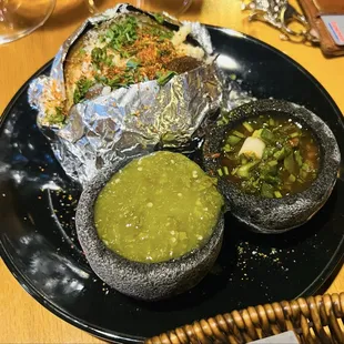 Baked potato and two sauces the server couldn&apos;t describe.