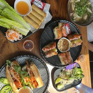 Combo pho, Lemongrass Chicken banh mi, Lemongrass Chicken spring rolls, and egg rolls
