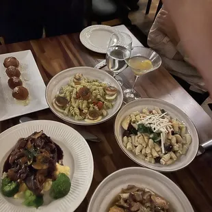 Nanas croquettes, scallops, pork chop, chicken Marsala, and fuscilli di Vuolo.
