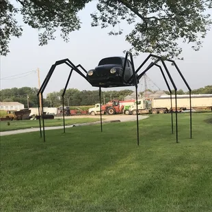 VW beetle made into a spider in the yard of someone in Avoca Iowa