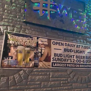 a brick wall with a sign for a bar