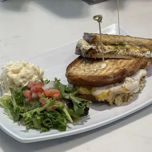 a sandwich and salad on a plate
