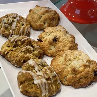 a plate of scones on a glass table