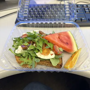a sandwich with watermelon and a slice of watermelon