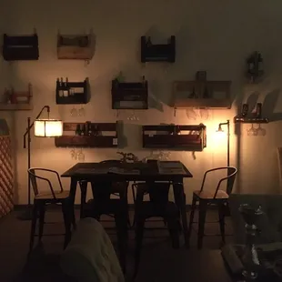 Evening by the wine rack area.