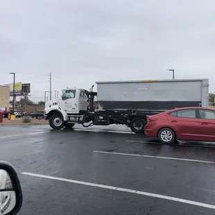 Driver backing into this poor elderly woman's car!