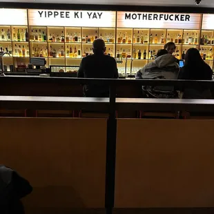 View of the bar from our table. Loved the sign!!