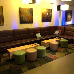 a couch, tables, and stools