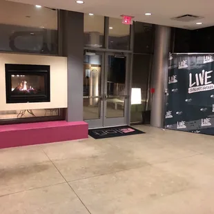 a fireplace in a lobby