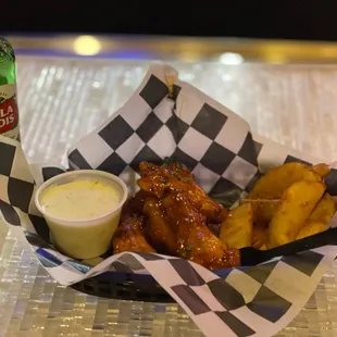 Sweet chili wings and fries. With a beer
