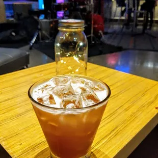 a drink in a glass on a table