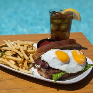 Our Special, BELT, Two over easy organic eggs on top of bacon, lettuce, and tomato sandwitch