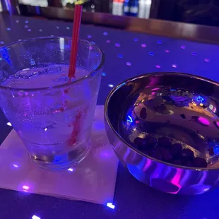 Vodka tonic and some mixed nuts.