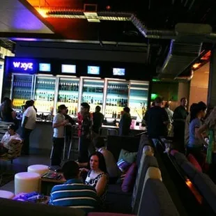 a group of people at a bar