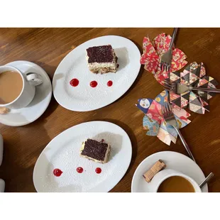 two plates of food and a cup of coffee