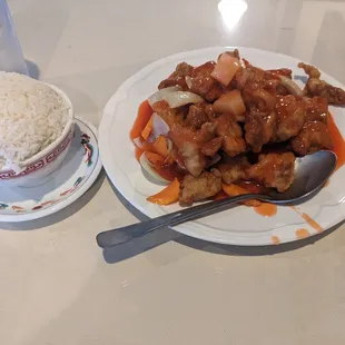 This is rice and sweet &amp; sour chicken.