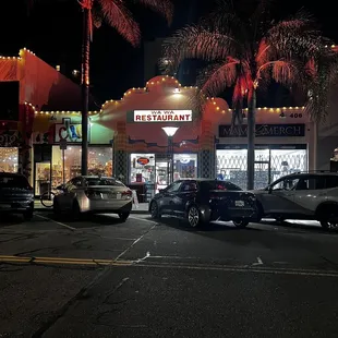 cars parked in front of the restaurant
