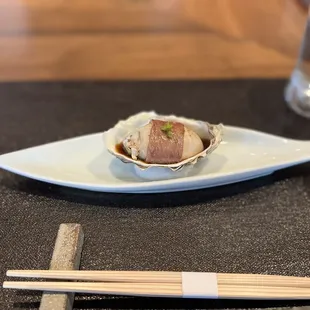 a plate of food and chopsticks