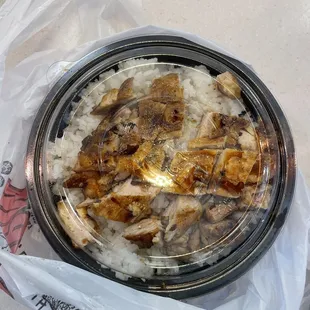 a bowl of rice and meat