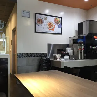 The back of the restaurant with the drinks. Restrooms to the left.