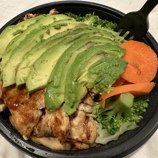 Chicken veggie bowl, white meat, brown rice, avocado .
