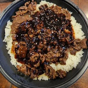 a plate of beef and rice